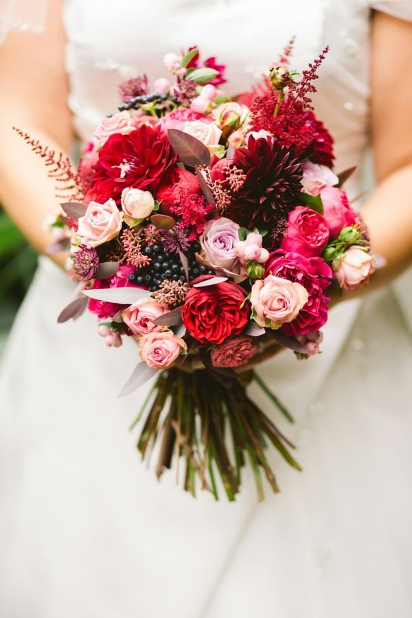 Bride holding a bouquet of white flowers