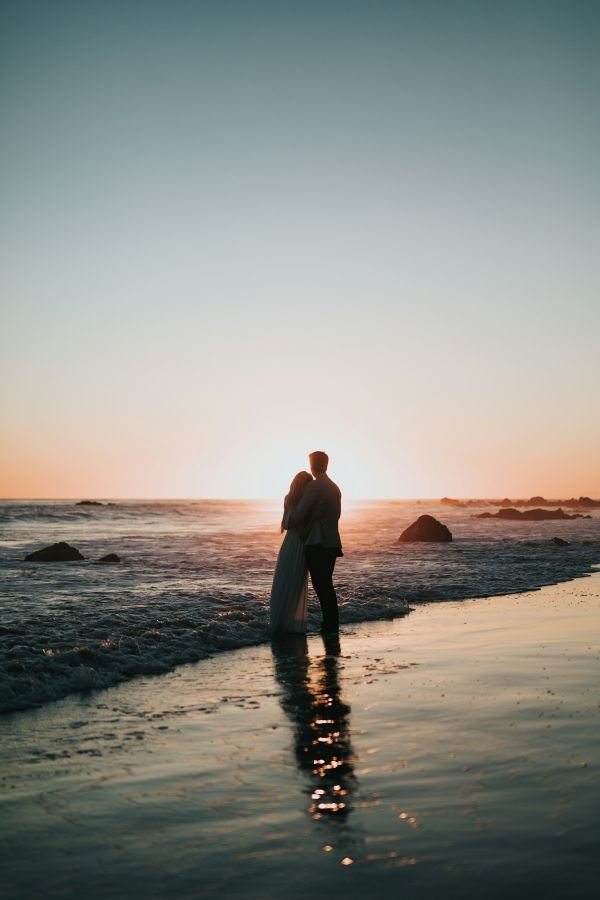 Couple on a beach at sunset
